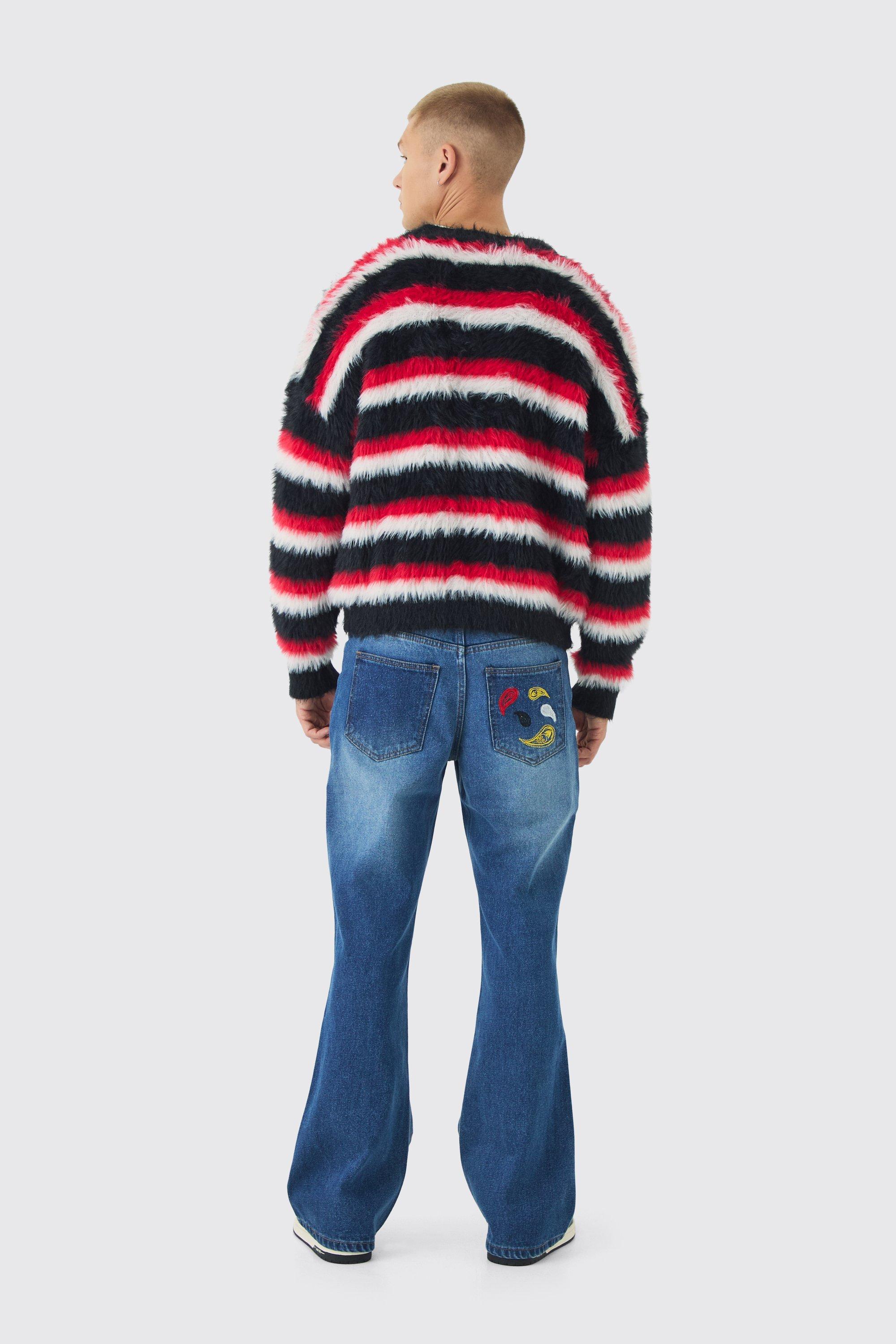 Jeans a zampa in denim rigido rilassati con ricami in fantasia cachemire